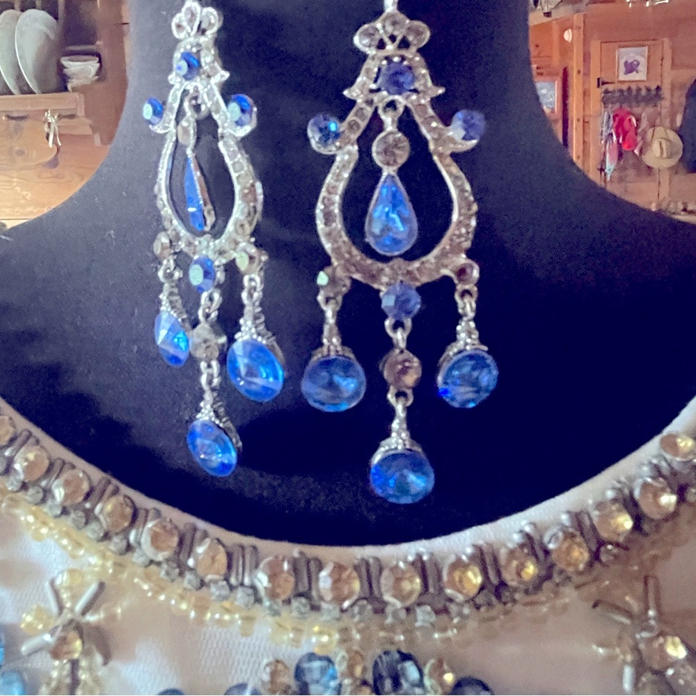 Approximately 2.5” pierced chandelier style earring.  Blue stones.